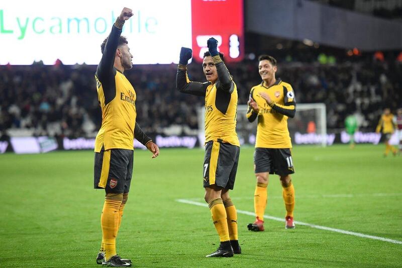 Arsenal’s Alexis Sanchez, left, Mesut Ozil, right, and Alexandre Lacazette will be out in force against West Brom this weekend. Justin Tallis / AFP