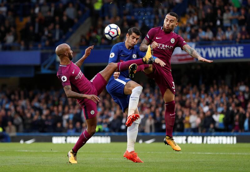 Soccer Football - Premier League - Chelsea vs Manchester City - Stamford Bridge, London, Britain - September 30, 2017  Chelsea���s Alvaro Morata in action with Manchester City's Nicolas Otamendi and Fabian Delph   Action Images via Reuters/John Sibley  EDITORIAL USE ONLY. No use with unauthorized audio, video, data, fixture lists, club/league logos or "live" services. Online in-match use limited to 75 images, no video emulation. No use in betting, games or single club/league/player publications. Please contact your account representative for further details.