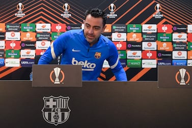 Barcelona's Spanish coach Xavi addresses a press conference in Barcelona on February 16, 2022, on the eve of their UEFA Europa League football match against Napoli. (Photo by LLUIS GENE / AFP)