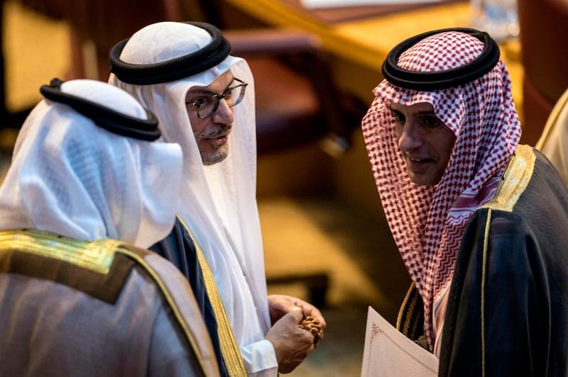 Saudi Foreign Minister Adel al-Jubeir (R) talks with UAE Minister of State for Foreign Affairs Anwar Gargash (C) during meeting at the Arab League headquarters in the Egyptian capital Cairo on November 19, 2017.
Arab foreign ministers gathered in Cairo at Saudi Arabia's request for an extraordinary meeting to discuss alleged "violations" committed by Iran in the region. / AFP PHOTO / KHALED DESOUKI