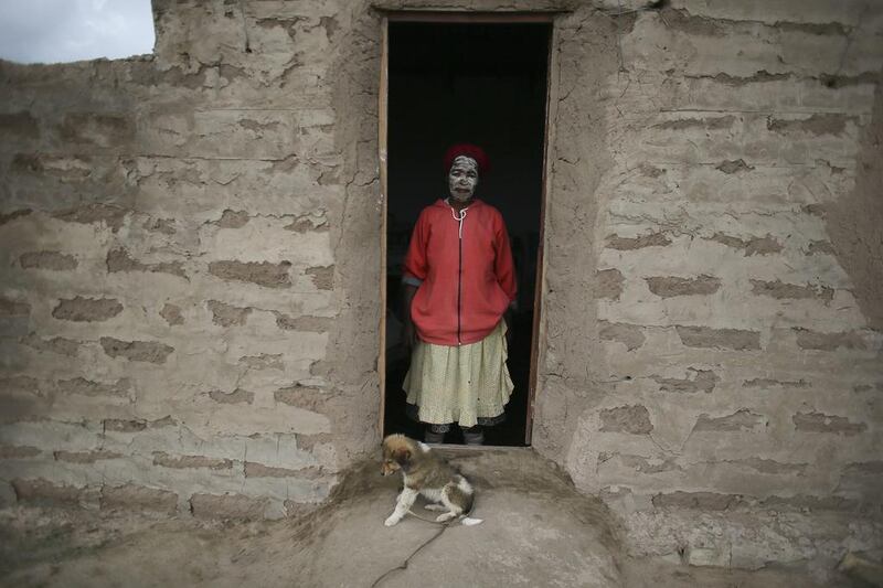 Sixty-two-year-old South African woman Olivia Tsangane, a neighbour of late South African president Nelson Mandela, poses for a photograph in Mandela’s ancestral village of Qunu, South Africa.  Nic Bothma / EPA