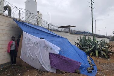 Migrants sleep on cardboard boxes and under a makeshift tent near Benitez beach, Ceuta. Karen Rice