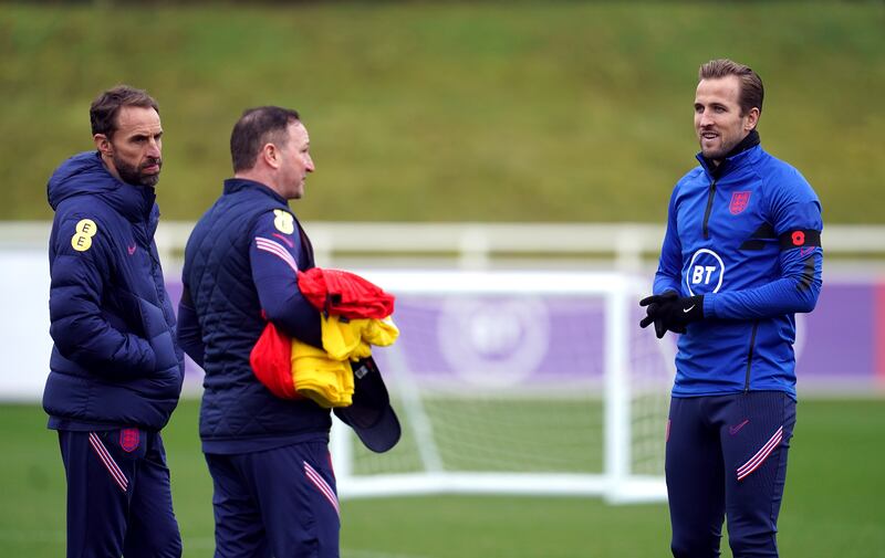 England's Harry Kane, manager Gareth Southgate, left, and assistant manager Steve Holland during a training session at St George's Park on Thursday, November 11, 2021. PA