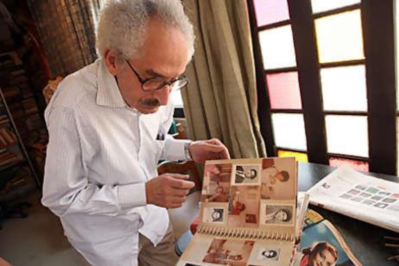 Ibrahim looks at old photographs at home in the Cairo suburb of Heliopolis. <i>Stealth</i>, his latest novel to be translated into English, is an autobiographical account of a child's relationship with his father.