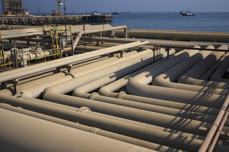 Oil pipelines sit on the quayside beside the Arabian Sea at the North Pier terminal in Saudi Aramco's Ras Tanura oil refinery and oil terminal in Ras Tanura, Saudi Arabia, on Monday, Oct. 1, 2018. Saudi Arabia is seeking to transform its crude-dependent economy by developing new industries, and is pushing into petrochemicals as a way to earn more from its energy deposits. Photographer: Simon Dawson/Bloomberg