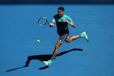 epa07298734 Milos Raonic of Canada in action against Pierre-Hugues Herbert of France during their round three men's singles match at the Australian Open Grand Slam tennis tournament in Melbourne, Australia, 19 January 2019.  EPA/HAMISH BLAIR AUSTRALIA AND NEW ZEALAND OUT