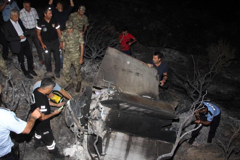 Turkish Cypriot police and inspectors check the remains of what officials said was a suspected Russian missile that exploded overnight on July 1, 2019, in the northern part of the divided island, during an Israeli aerial raid in Syria. The object is thought to have exploded before hitting the ground.   The missile defence system may have been set off by Israeli air strikes that killed at least 15 people near the Syrian capital Damascus and in Homs province late on June 30. 
Russia supports the Syrian government in the eight-year war against rebel groups, and has provided extensive missile defence systems.
 / AFP / DIYALOG NEWSPAPER / -
