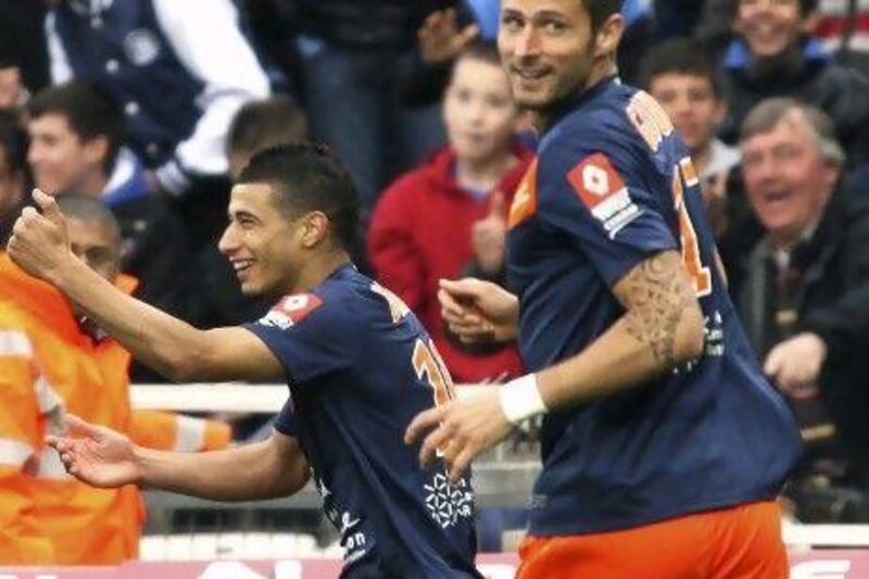 Montpellier’s Younes Belhanda, left, and Olivier Giroud celebrate a goal last month, but had an on-field spat last weekend.