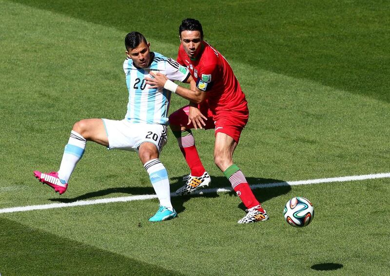 Sergio Aguero of Argentina competes for the ball with Javad Nekounam of Iran during their match on Saturday at the 2014 World Cup in Belo Horizonte, Brazil. Ian Walton / Getty Images