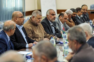 Politicians from the various Palestinian factions attend a meeting in Gaza City on November 20, 2021. AFP