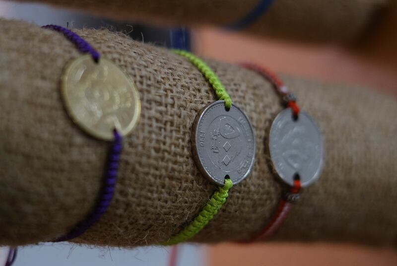 Both 250 and 500 Lebanese pound coin bracelets are on display inside a shop in Tripoli, northern Lebanon. All photos: Reuters