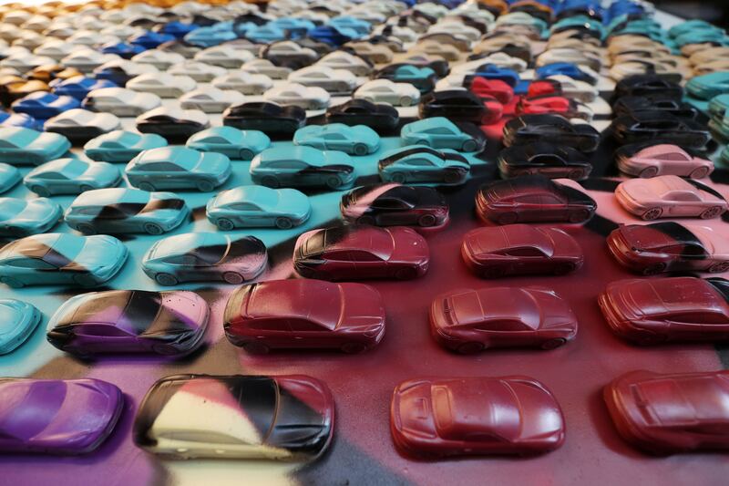 Artist Dozi Dreams affixed 500 metallic Porsche miniatures on a canvas for DRVN by Porsche.