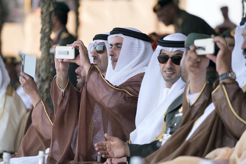 ZAYED MILITARY CITY, ABU DHABI, UNITED ARAB EMIRATES - November 28, 2017: (L-R) HH Sheikh Saeed bin Zayed Al Nahyan, Abu Dhabi Ruler's Representative, HH Lt General Sheikh Saif bin Zayed Al Nahyan, UAE Deputy Prime Minister and Minister of Interior, HH Sheikh Khaled bin Zayed Al Nahyan, Chairman of the Board of Zayed Higher Organization for Humanitarian Care and Special Needs (ZHO), attend the graduation ceremony of the 8th cohort of National Service recruits and the 6th cohort of National Service volunteers at Zayed Military City. 

( Hamad Al Kaabi / Crown Prince Court - Abu Dhabi )
—