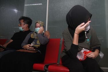 Relatives of passengers on board missing Sriwijaya Air flight SJ182 wait for news at Supadio airport, West Kalimantan, Indonesia after contact with the aircraft was lost shortly after take-off from Jakarta. AFP