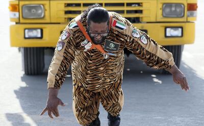 Dubai, United Arab Emirates - October 09, 2018: Samson of UAE, Hussain Khalil pulls two lorry cabs for a POAN. He is a Òsuper-power champÓ who can pull trucks with his hair, among other power stunts. Tuesday, October 9th, 2018 at Global Village, Dubai. Chris Whiteoak / The National