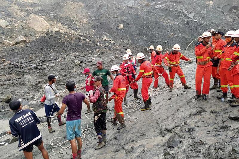 Rescue workers searching for people after a landslide accident at a jade mining site in Hpakant, Kachin State, Myanmar. EPA