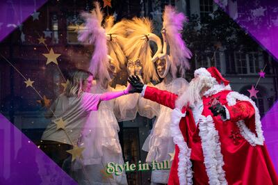 A man dressed as Santa Claus outside Selfridges in London as the department store unveils its Christmas windows on Oxford Street. PA