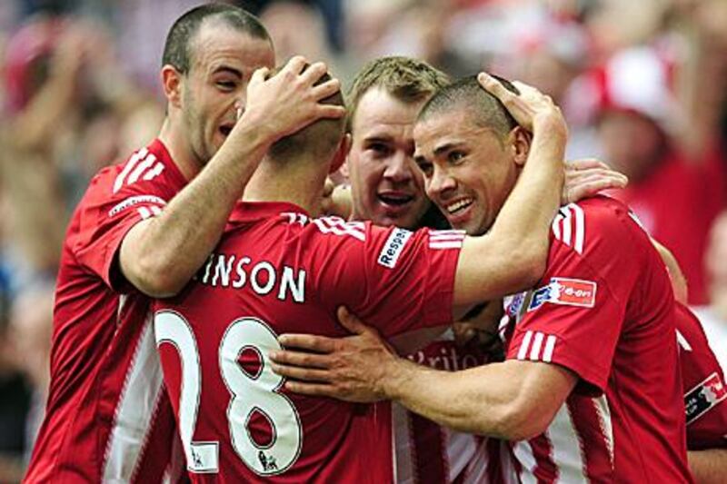 Stoke City players congratulate man of the match Jon Walters, right, after the Republic of Ireland striker netted his second in his side's 5-0 thrashing of Bolton Wanderers at Wembley Stadium yesterday to book their place in next month's FA Cup final against Manchester City.