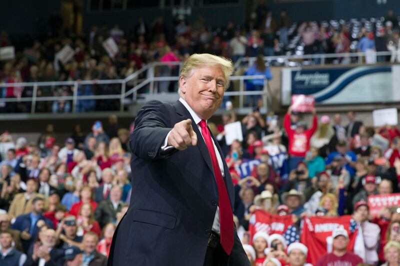 FILE - In this Nov. 26, 2018, file photo, President Donald Trump points to a supporter as he departs a rally at the Mississippi Coast Coliseum in Biloxi, Miss. President Donald Trumpâ€™s campaign has launched a state-by-state effort to prevent an intraparty fight that could spill over into the general-election campaign. The initiative includes changing state party rules, crowding out potential rivals and quelling any early signs of opposition. (AP Photo/Alex Brandon, File)