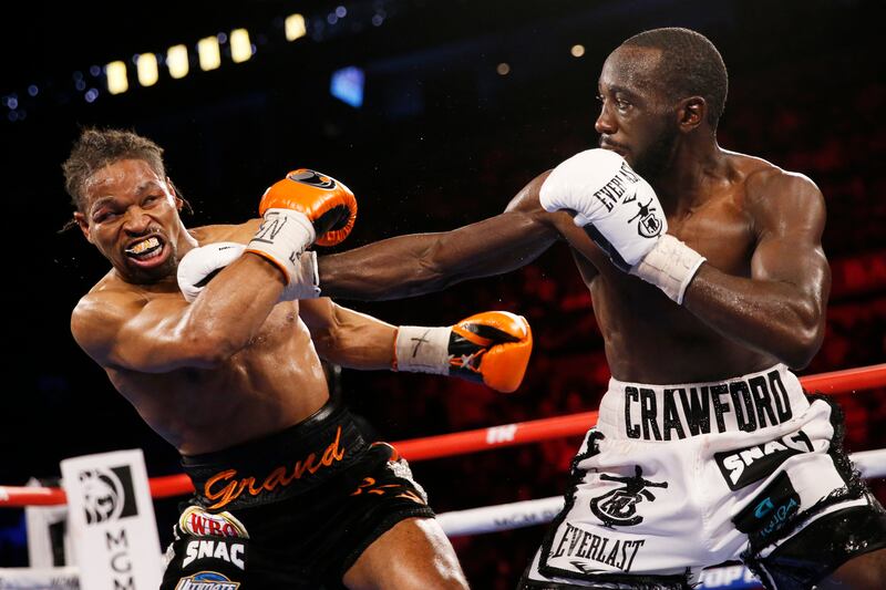 Terence Crawford hits Shawn Porter during a welterweight title boxing match. AP Photo