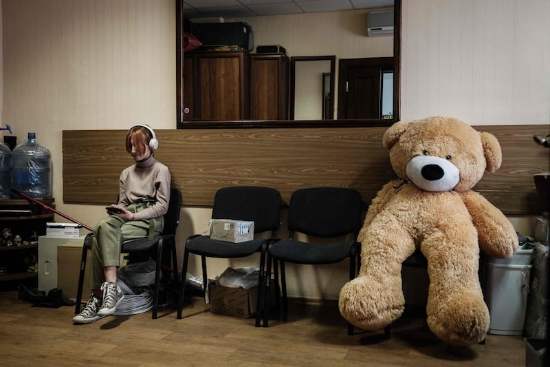 Katya, 11, waits for her mother's treatment to end at the Severodonetsk Hospital in Severodonetsk. AFP