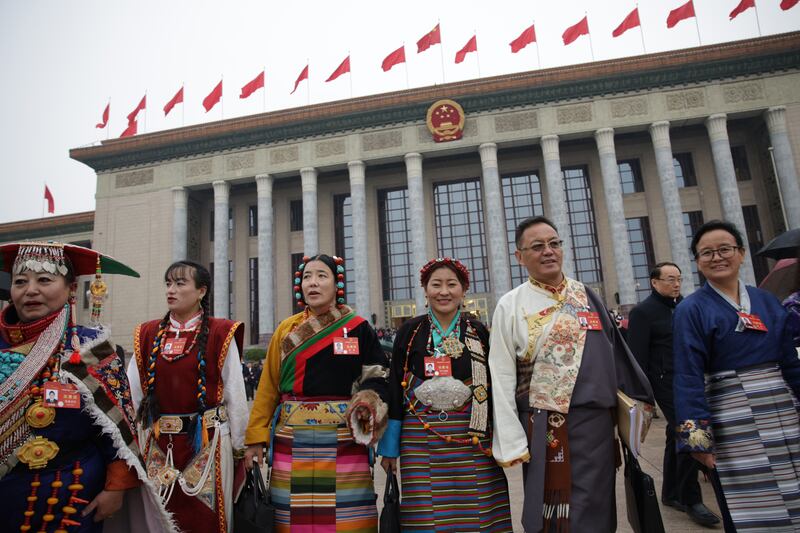 Chinese ethnic minority delegates leave the Great Hall of the People after the opening ceremony of the second session of the 14th National People's Congress of China in Beijing. EPA 
