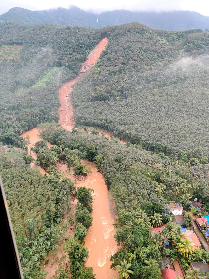 Scenes after a landslide triggered by heavy rains in the Western Ghats mountains in Koottickal, Kottayam district.  AP