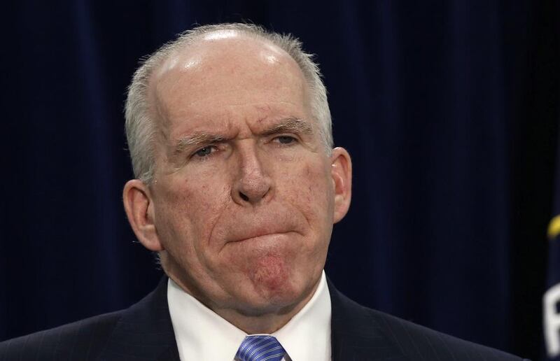 The CIA director John Brennan pauses while speaking about a senate committee report on the use of torture by his agency, at the CIA headquarters in Virginia on December 11, 2014. Larry Downing / Reuters