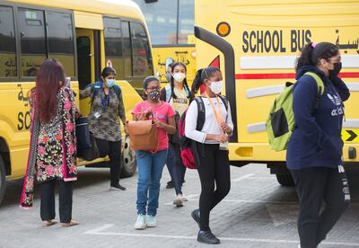Pupils arriving in school buses on the first day of in-person learning at Indian High School in Oud Metha, Dubai.  Ruel Pableo / The National