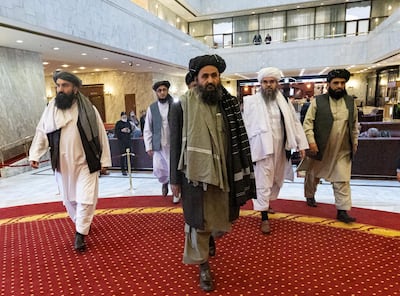 Taliban co-founder Mullah Abdul Ghani Baradar, center, arrives with other members of the Taliban delegation for attending an international peace conference in Moscow, Russia, Thursday, March 18, 2021. Russia is hosting a peace conference for Afghanistan, bringing together government representatives and their Taliban adversaries along with regional observers in a bid to help jump-start the country's stalled peace process. The one-day gathering Thursday is the first of three planned international conferences ahead of a May 1 deadline for the final withdrawal of U.S. and NATO troops from the country, a date fixed under a year-old agreement between the Trump administration and the Taliban. (AP Photo/Alexander Zemlianichenko, Pool)