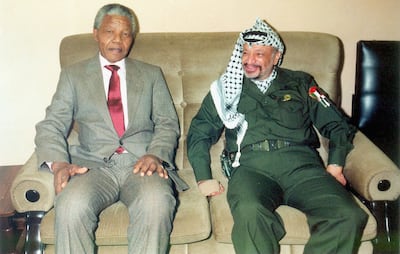Nelson Mandela with Yasser Arafat in October 2004. Getty Images