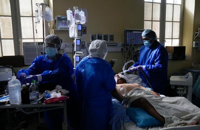 Medical workers attend an intubated Covid-19 patient in the ICU at the General Hospital in La Paz, Bolivia. AP Photo