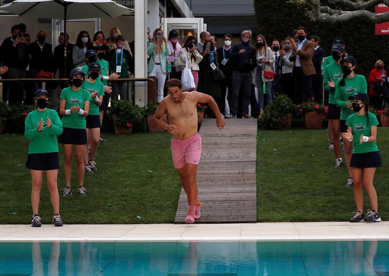 Spanish tennis player Rafael Nadal takes a bath at the pool of the club after defeating Greek tennis player Stefanos Tsitsipas in the Barcelona Open. EPA