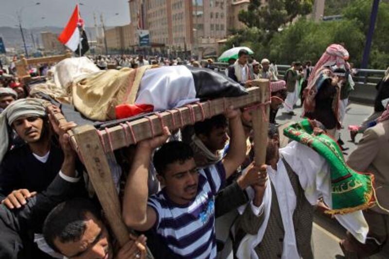 Relatives and friends of tribesmen loyal to Sheik Sadeq al-Ahmar, the head of the powerful Hashid tribe, who were killed in clashes with Yemeni security forces carry their bodies during their funeral procession in Sanaa, Yemen, Friday, June 3, 2011. Tens of thousands of Yemenis held a mass funeral Friday for 50 people killed in regime-sponsored violence in the capital. Heavy shelling expanded into new sections of the city. (AP Photo/Hani Mohammed) *** Local Caption ***  XMM104_Mideast_Yemen.jpg