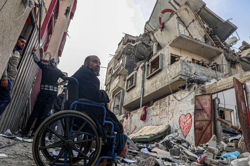 Palestinians look at the rubble of a home destroyed in an overnight Israeli air strike in the Rafah refugee camp in southern Gaza. AFP