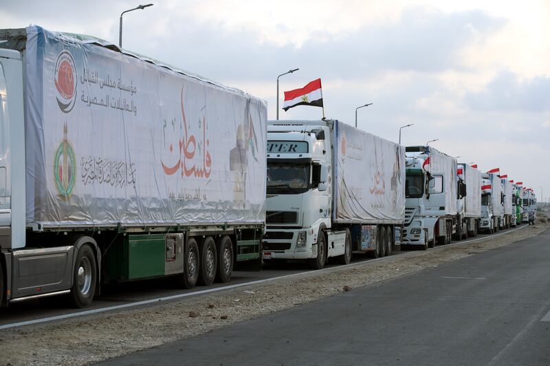 Lorries carrying humanitarian aid bound for the Gaza Strip wait to pass through the Rafah border crossing, Egypt. EPA