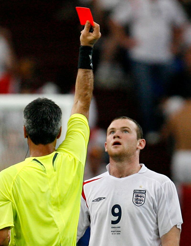 Referee Horacio Elizondo issues a red card to England's Wayne Rooney in the World Cup quarter-final match between England and Portugal in Gelsenkirchen, Germany on July 1, 2006. AP