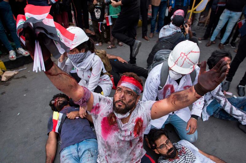 Actors perform a play representing the ongoing anti-government demonstrations in Tahrir Square. AFP