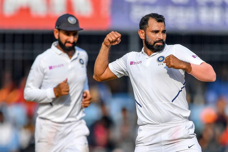 India's Mohammed Shami (R) celebrates after the dismissal of Bangladesh's Taijul Islam during the third day of the first Test cricket match of a two-match series between India and Bangladesh at Holkar Cricket Stadium in Indore on November 16, 2019.  - ----IMAGE RESTRICTED TO EDITORIAL USE - STRICTLY NO COMMERCIAL USE----- / GETTYOUT
 / AFP / Indranil MUKHERJEE / ----IMAGE RESTRICTED TO EDITORIAL USE - STRICTLY NO COMMERCIAL USE----- / GETTYOUT
