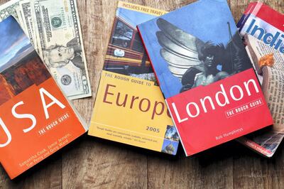 London, United Kingdom - July 20, 2011: Travel guide books for USA, Europe, London and India. These guides are published by Rough Guide and Lonely Planet, the largest travel guide book publisher in the world.