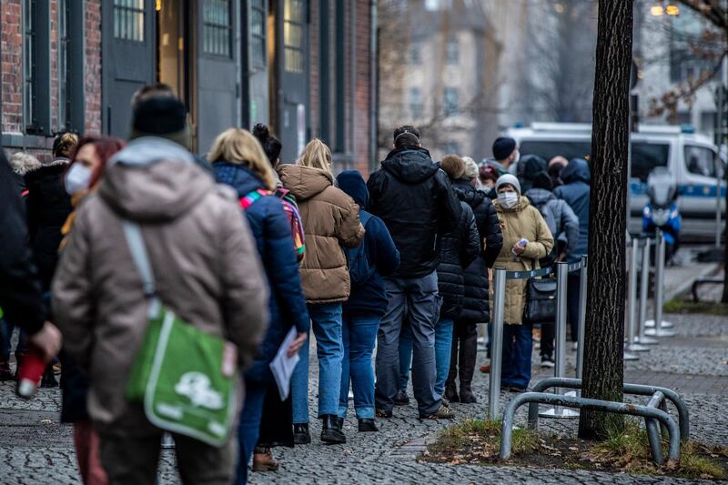 People line up to enter Treptow Arena Berlin vaccine center to receive the first stage of the Pfizer/BioNTech vaccine in Berlin, Germany. Getty Images
