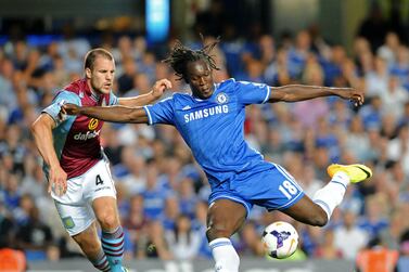 (FILES) In this file photo taken on August 21, 2013 Chelsea's Belgian striker Romelu Lukaku (R) vies with Aston Villa's Dutch defender Ron Vlaar (L) during the English Premier League football match between Chelsea and Aston Villa at Stamford Bridge in London on August 21, 2013.  - Romelu Lukaku returned to Chelsea on August 12, 2021 for a reported club record fee of £97 million ($135 million) from Inter Milan, seven years after his first spell at Stamford Bridge came to an end.  (Photo by Olly GREENWOOD  /  AFP)