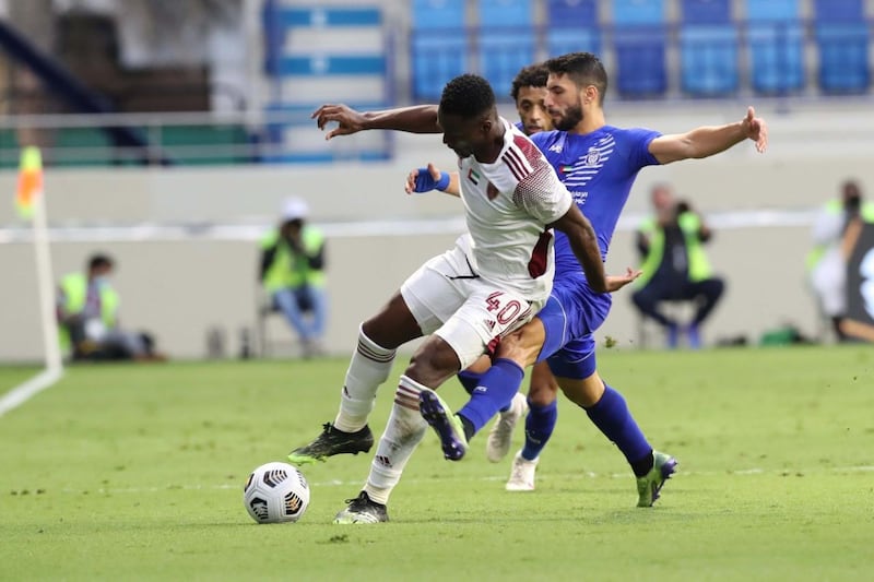 Al Wahda’s Paul Mpuko is challenged by Al Nasr’s Diaa Sabah in the Arabian Gulf League Round-12 at the Al Maktoum stadium on Friday, January 1, 2021. Courtesy PLC

 