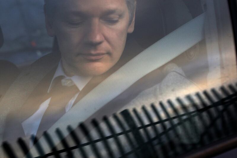 FILE - In this Jan. 11, 2011 file photo, WikiLeaks founder Julian Assange arrives at Belmarsh Magistrate's court in London for an extradition hearing. According to a cache of internal WikiLeaks files obtained by The Associated Press, Assange sought a Russian visa and staffers at his radical transparency group discussed having him skip bail and escape Britain as authorities closed in on him in late 2010. (AP Photo/Sang Tan)