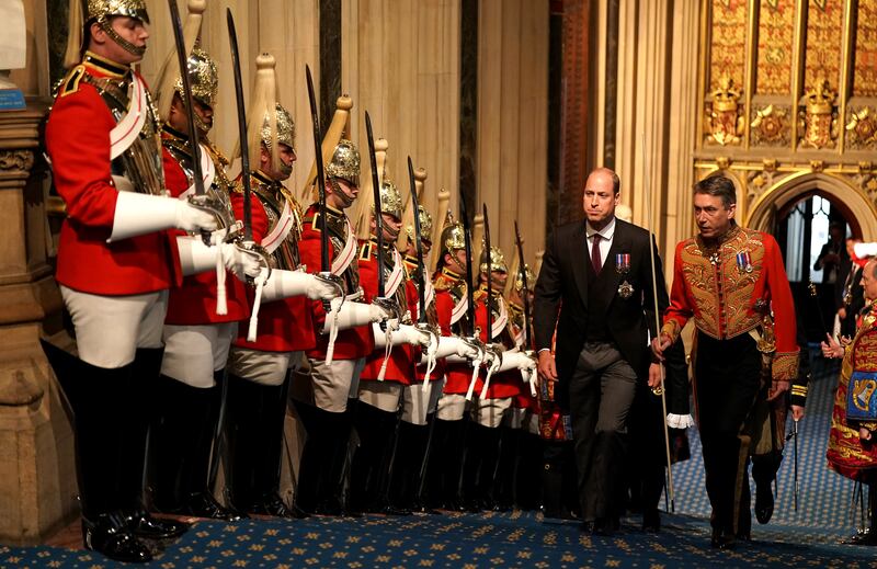 Prince William walks past the The Household Cavalry at the Palace of Westminster.