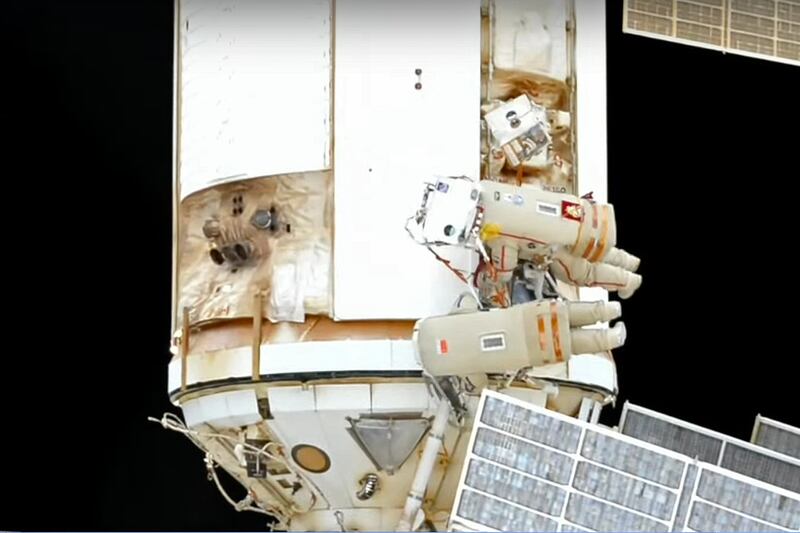 In this photo taken from video footage released by Roscosmos Space Agency, Roscosmos' cosmonauts Oleg Artemyev and Denis Matveev are seen during their spacewalk on the International Space Station (ISS), Wednesday, Aug.  17, 2022.  Roscosmos' cosmonauts Oleg Artemyev and Denis Matveev make a spacewalk at the space station to continue installation work of the European Space Agency's robot arm on the new Russian lab.  (Roscosmos Space Agency via AP)