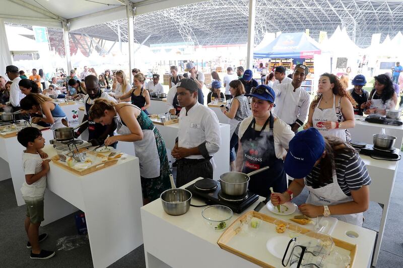 ABU DHABI , UNITED ARAB EMIRATES ,  November 9 , 2018 :- People taking part in the cooking challenge during the Taste of Abu Dhabi held at Du Arena on Yas Island in Abu Dhabi.  ( Pawan Singh / The National )  For News/Online/Instagram