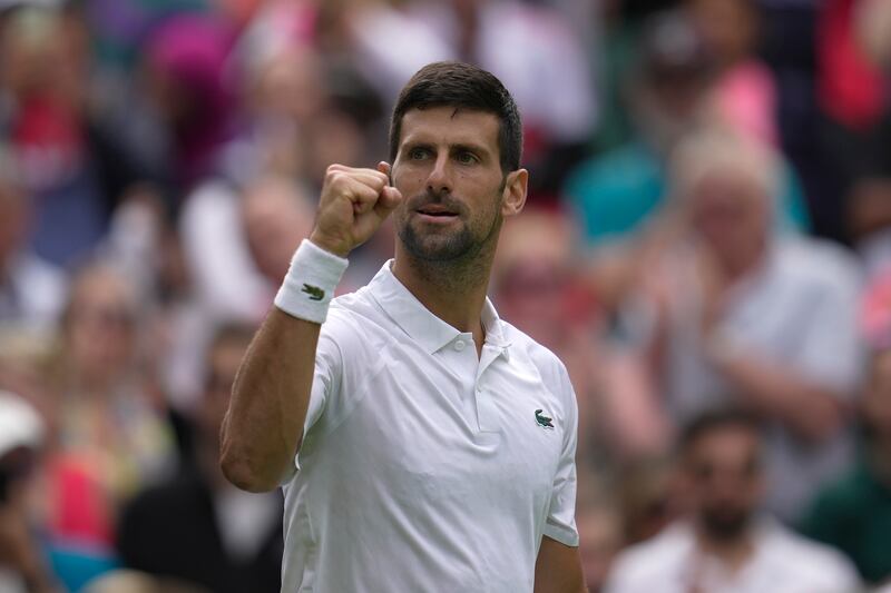Serbia's Novak Djokovic celebrates after beating Argentina's Pedro Cachin in a first round of the Wimbledon championships in London on July 3, 2023. AP