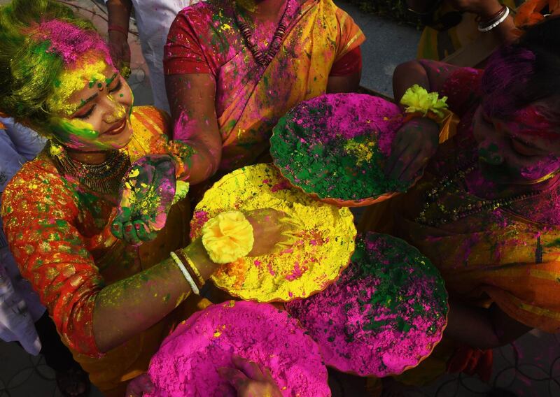Indian students celebrate Holi festival in Kolkata.  Dibyangshu Sarkar / AFP Photo