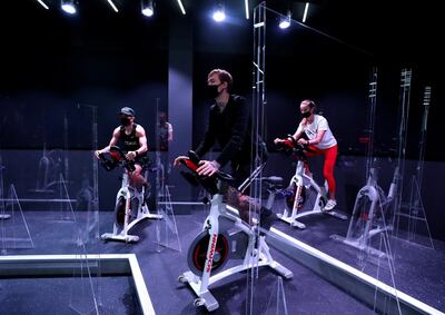 Dubai, United Arab Emirates - Reporter: N/A: News. Covid-19/Coronavirus. Maria, Fraz and Nuno (L) work out. Crank an Indoor Cycling & Boutique Fitness Studio have brought in partitions between bikes to protect their customers from Covid-19. Monday, June 1st, 2020. Dubai. Chris Whiteoak / The National